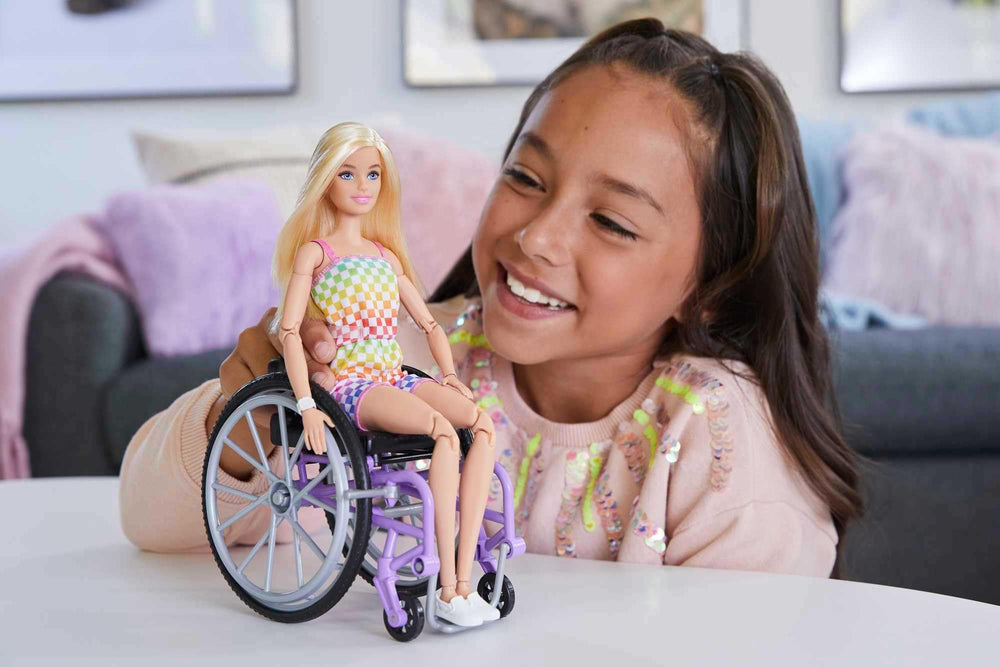 Barbie Fashionistas doll with purple wheelchair enables accessible storytelling and mobile play.