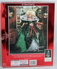 Barbie Happy Holidays dress detail with rhinestones and poinsettia accents for keepsake display.