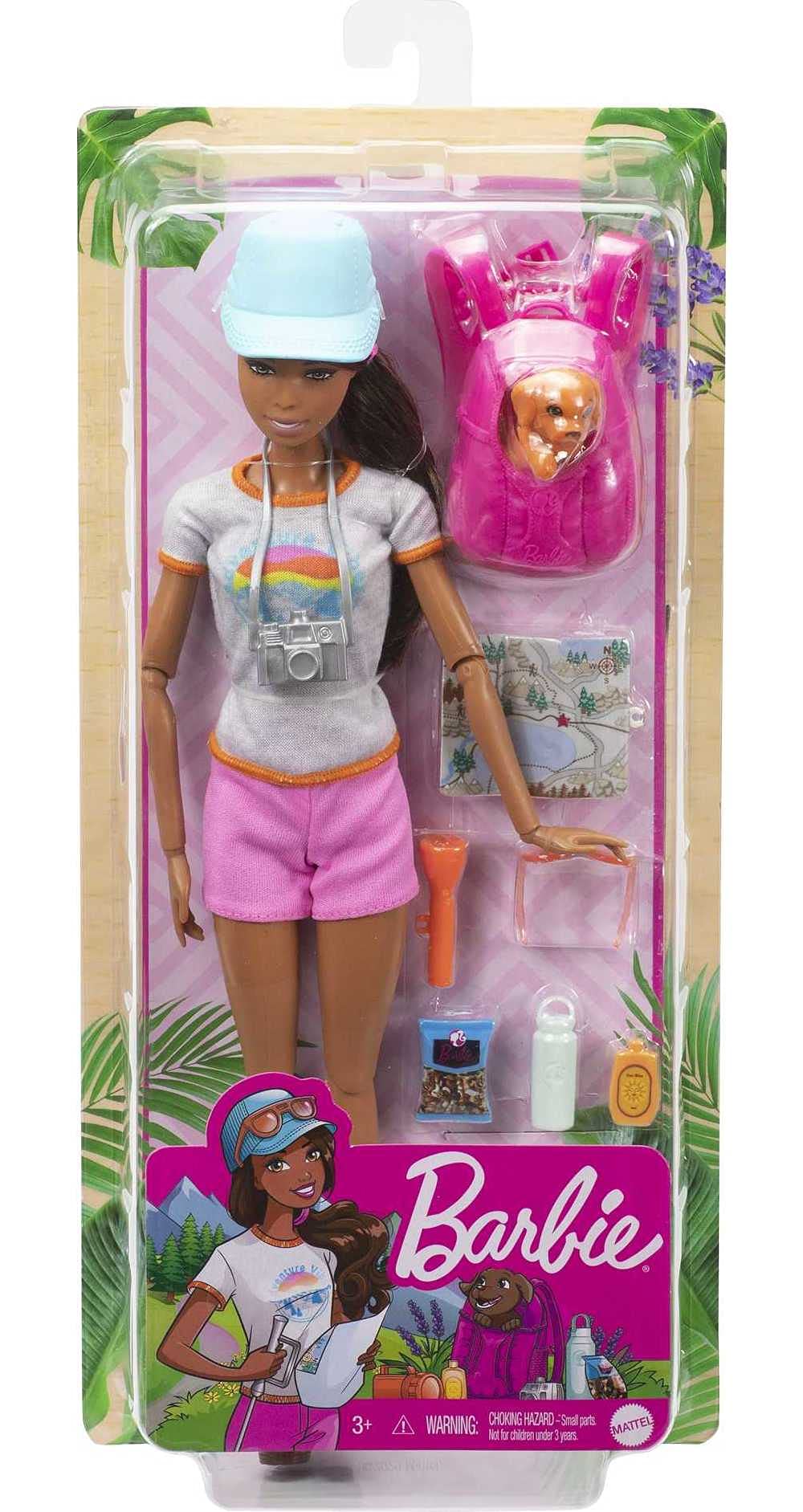 Barbie hiking doll with glasses and camera to observe and capture moments.