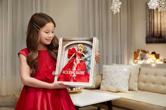 Barbie Holiday Doll featuring blonde waves and side-part hairstyle for elegant posing