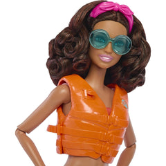 Barbie HPL69 articulated doll offers lifelike posing for surfing adventures.