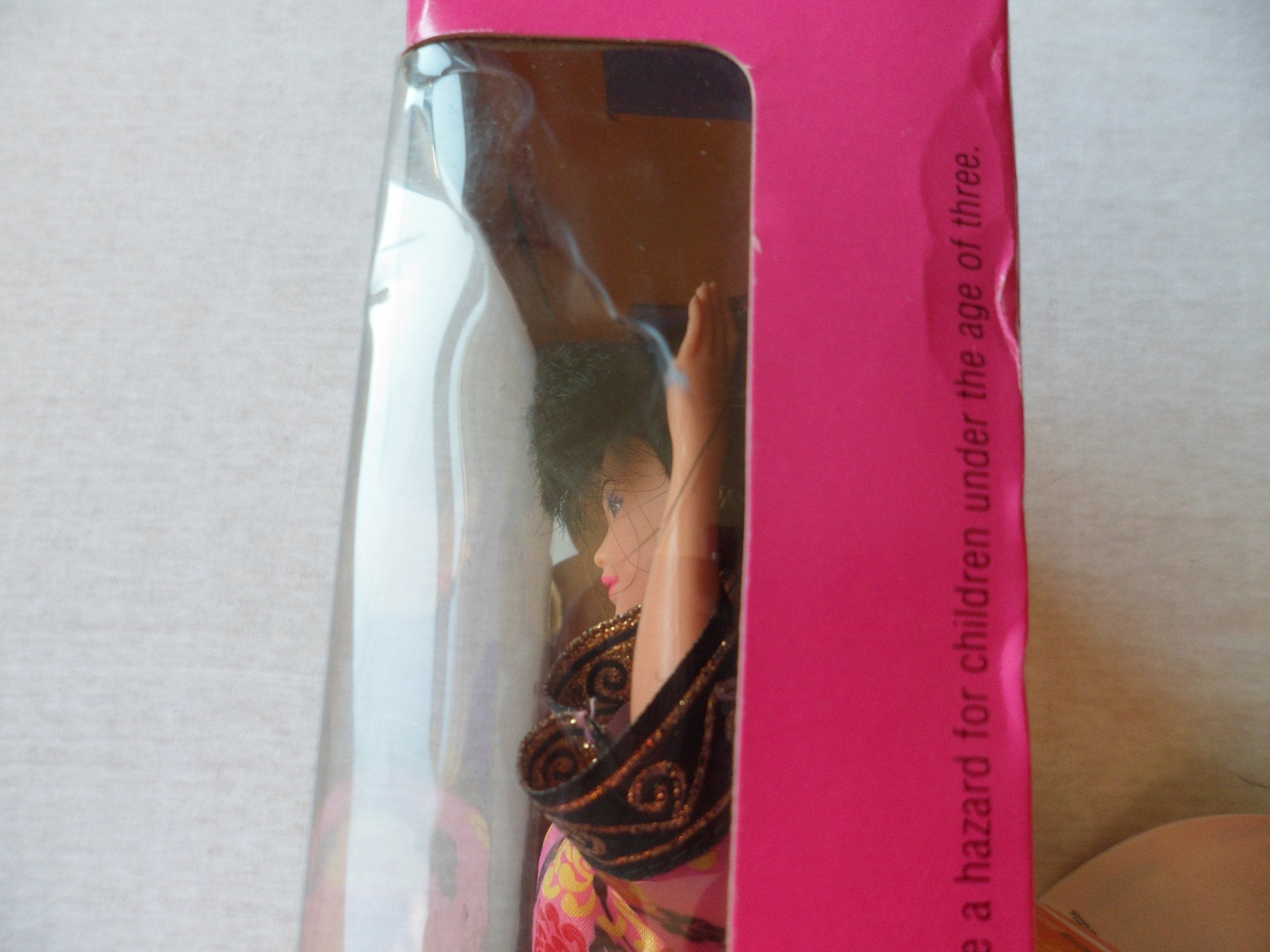 Includes brush and display stand for easy setup of Barbie doll.