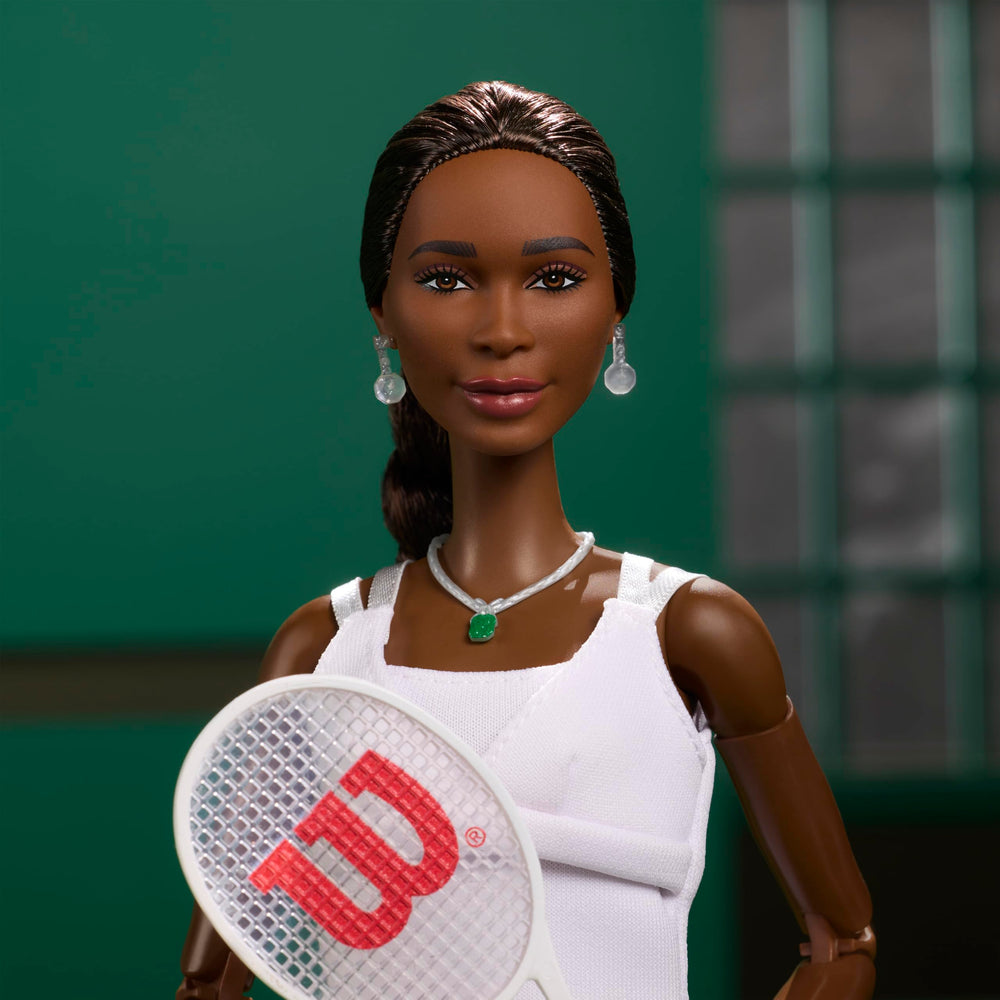 Barbie Venus Williams doll wearing green gem necklace detail.