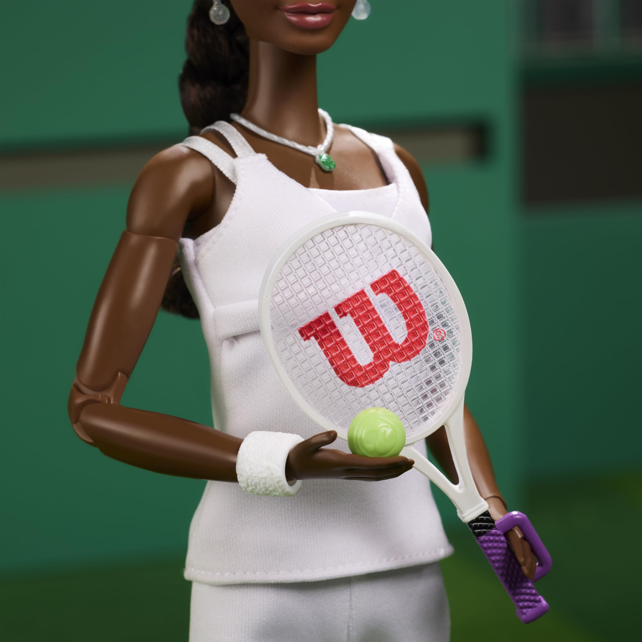 Barbie Venus Williams doll with visor and sneakers for court-ready look.