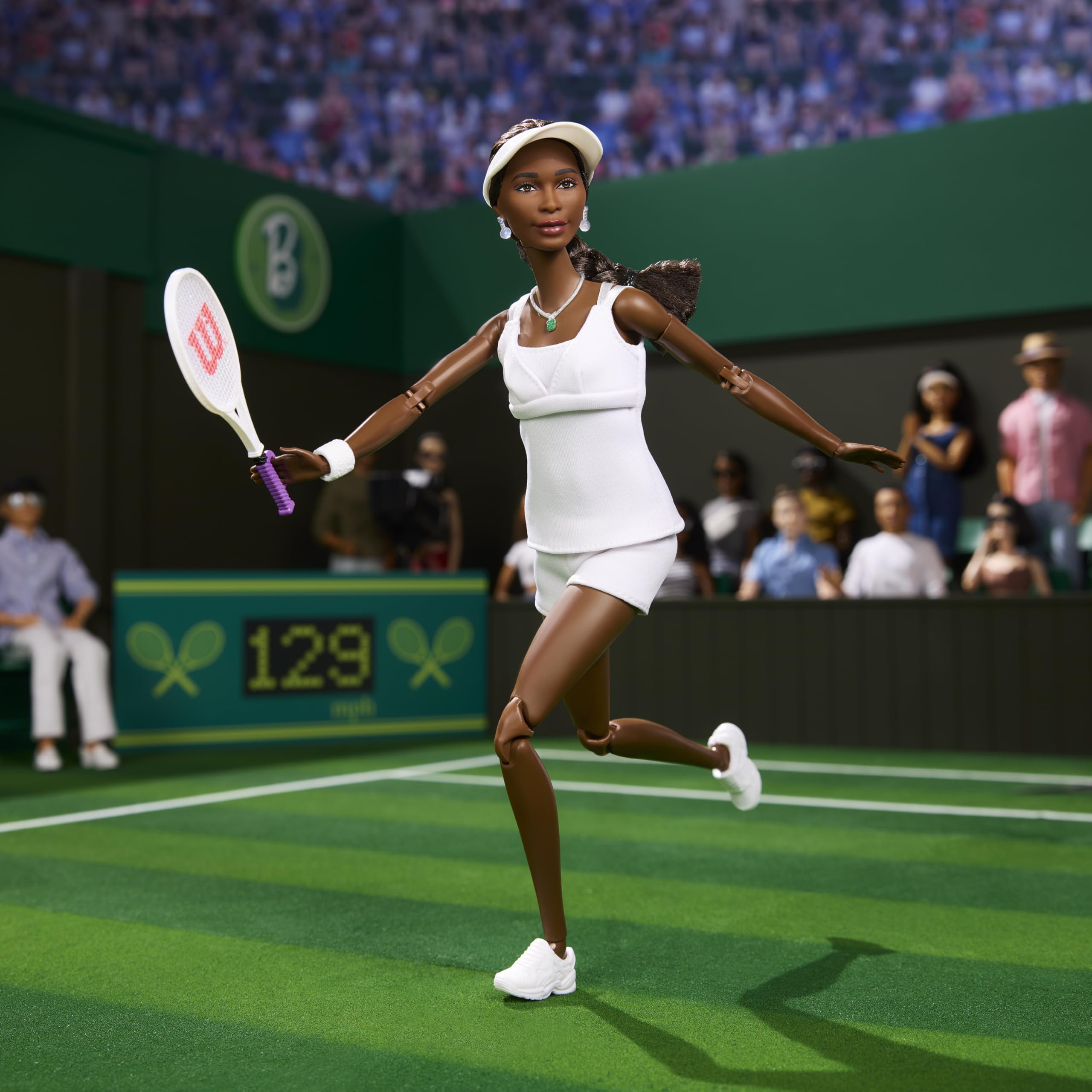 Barbie Venus Williams doll with signed tennis racket for collectors.