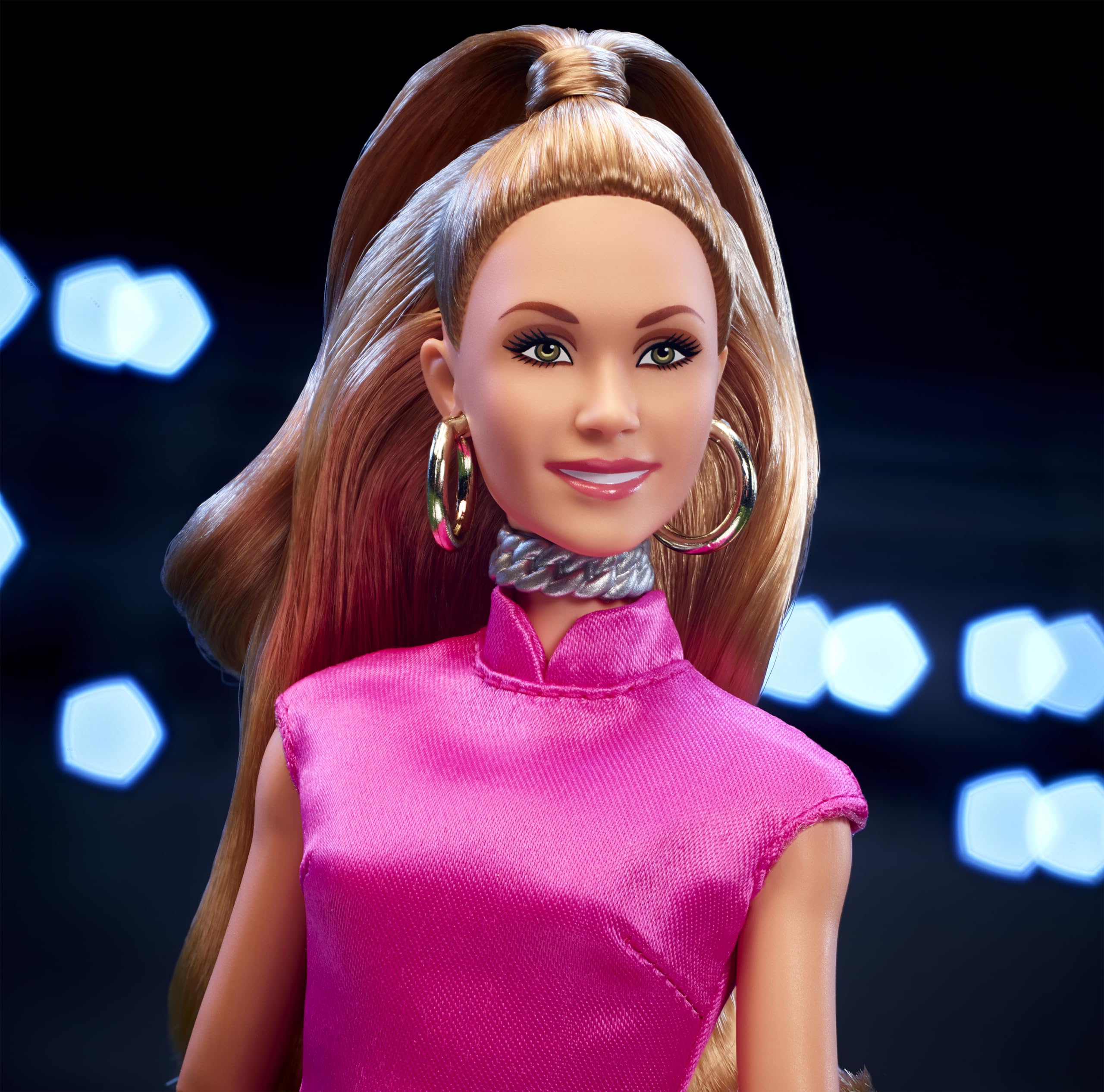 Barbie Keeley wearing golden hoops and pink clutch, ready for photo-ready posing.