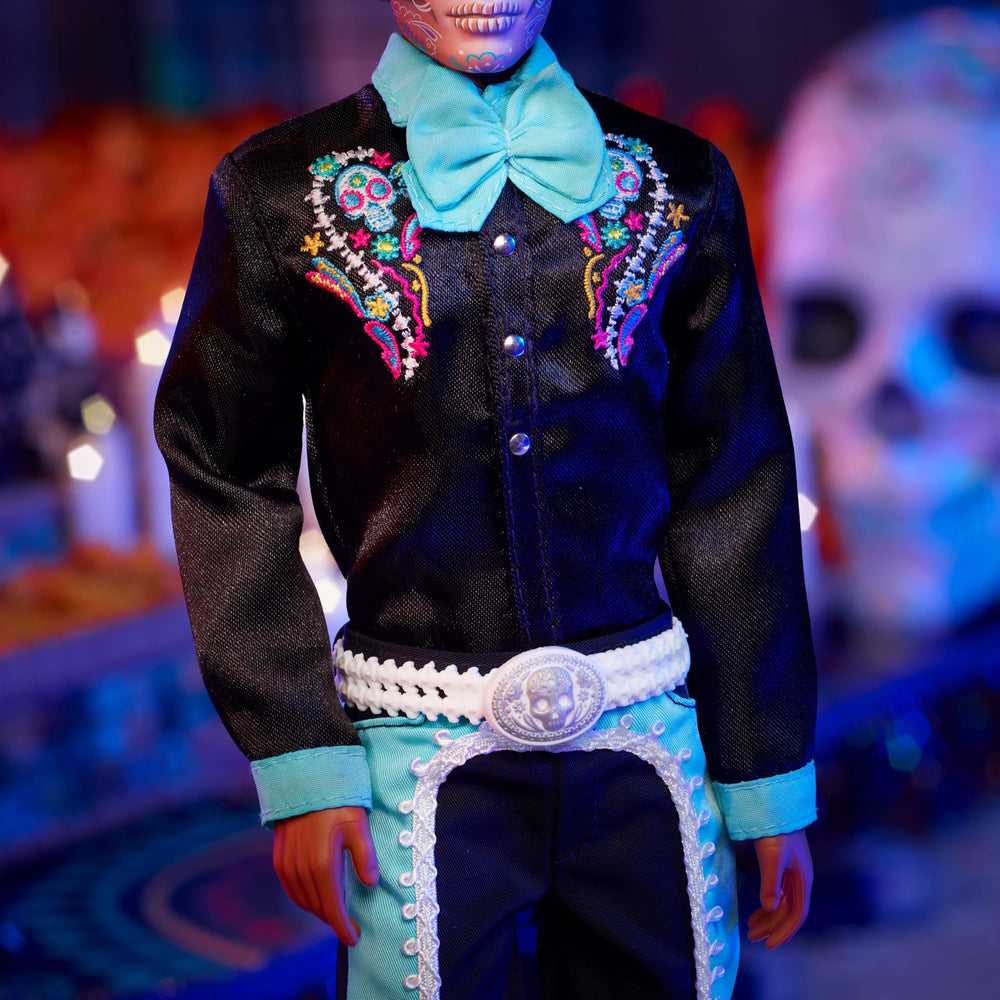 Barbie Ken doll embroidered with flowers, bones, and sugar skulls for vivid detail.