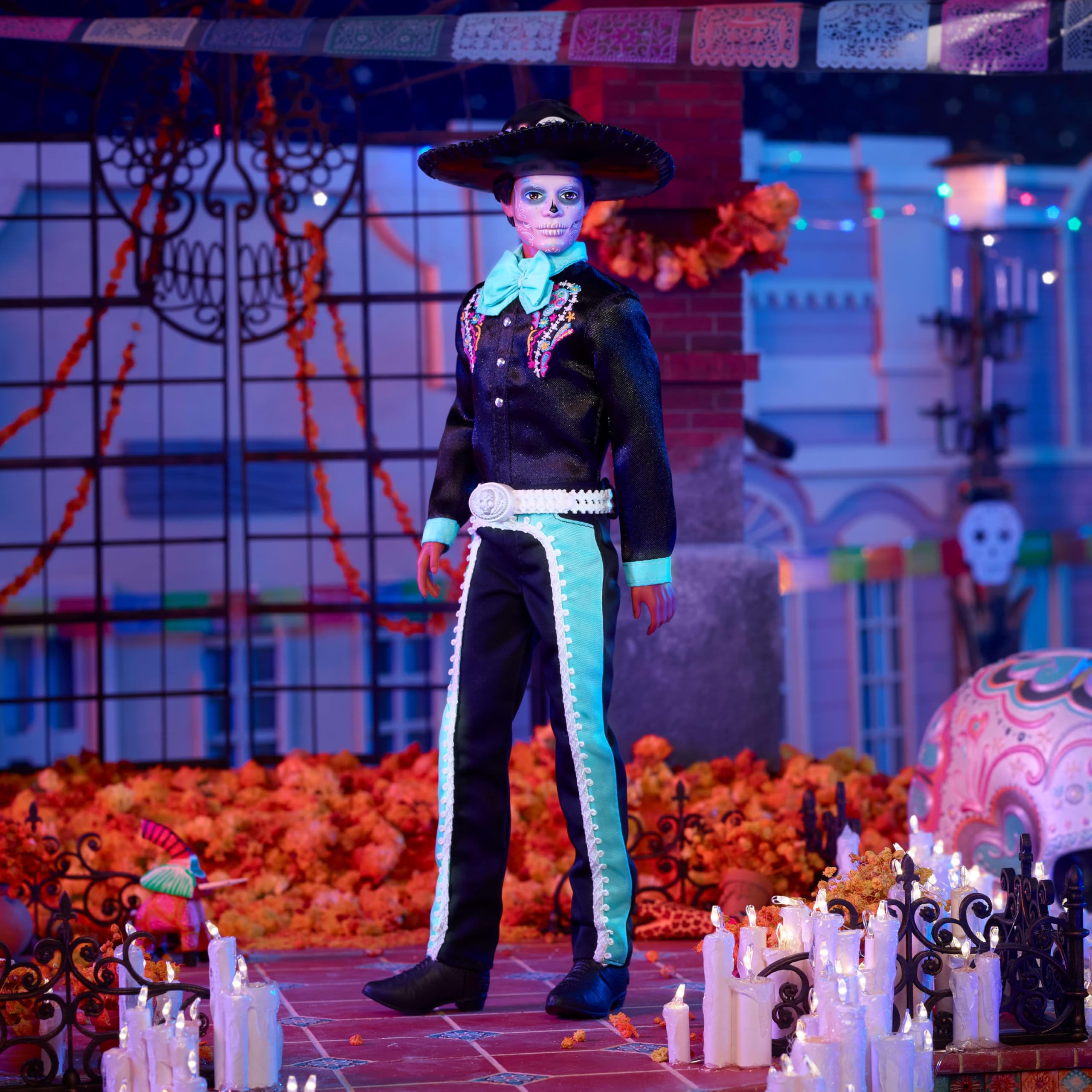 Barbie Ken doll with glossy sombrero and blue calavera face paint, festive shelf decor.