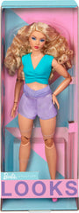 Barbie Looks doll stand and certificate of authenticity for display and collection.