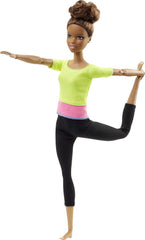 Barbie Made to Move doll in bike ride pose highlighting active play and storytelling.