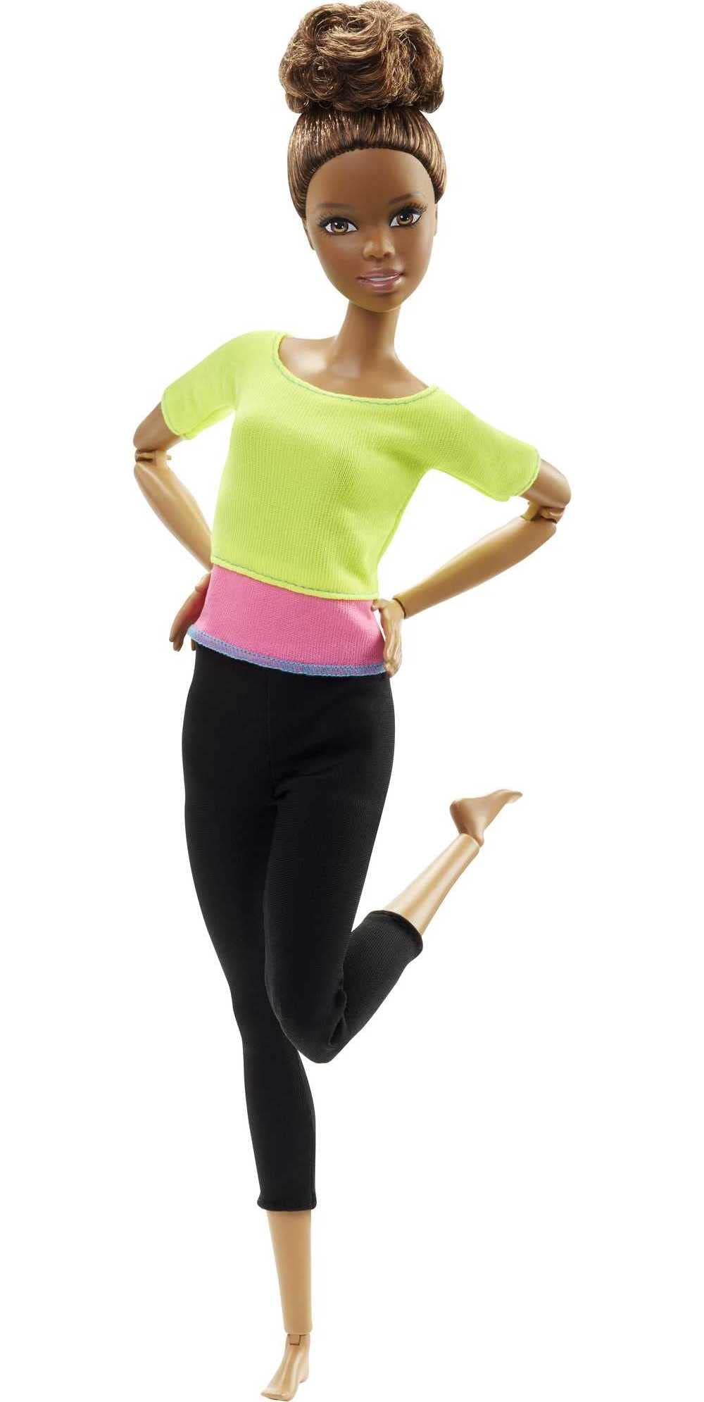 Barbie Made to Move doll with brown hair, green top and leggings in action pose for imaginative play.