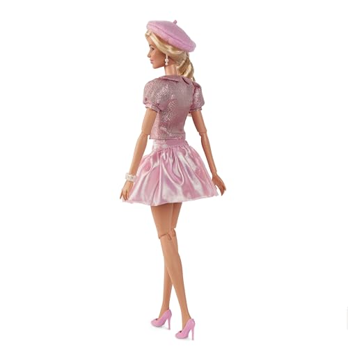 Barbie doll with beret and hair bow, perfect for fashion-inspired play.
