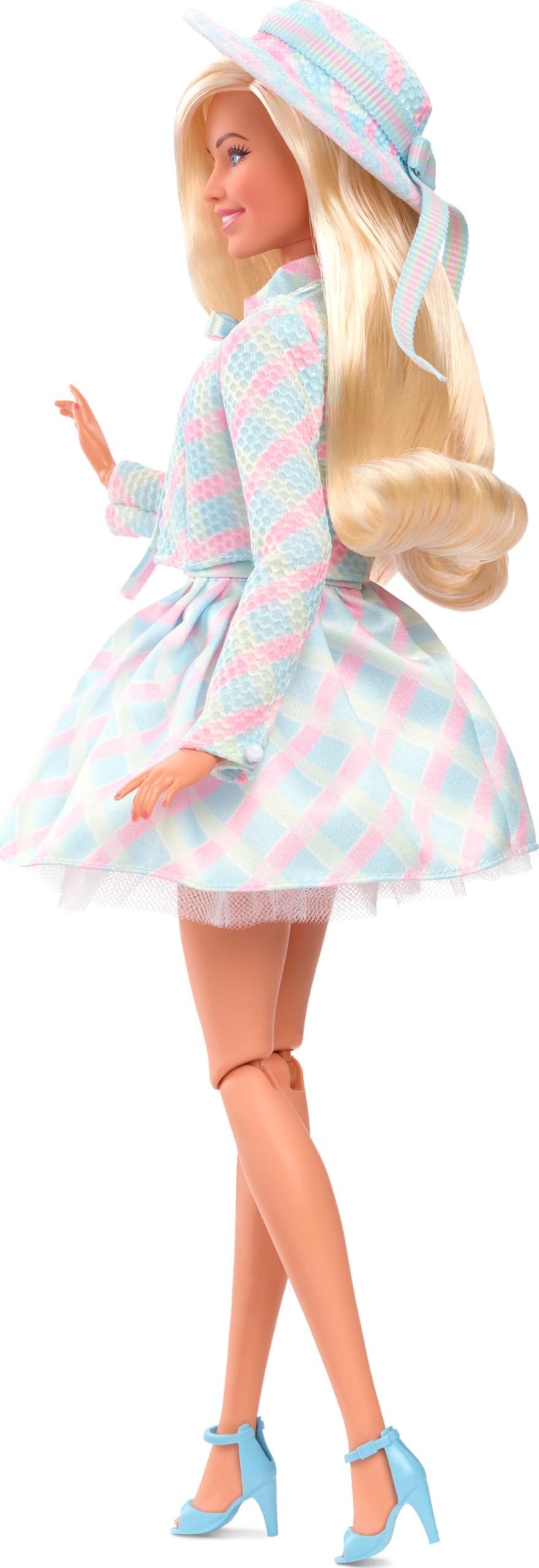 Barbie The Movie doll with pearl earrings for a refined look