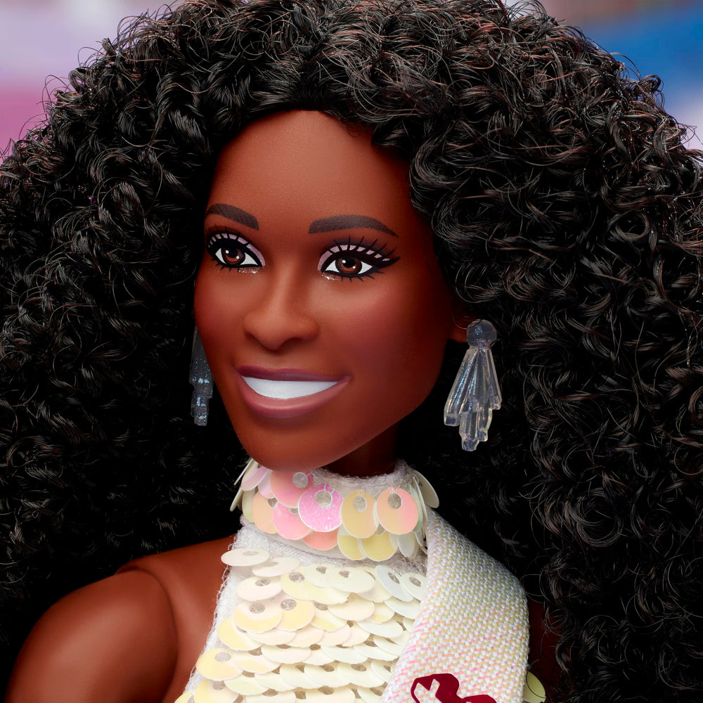 Barbie doll wearing golden heels to complete the elegant presidential outfit.