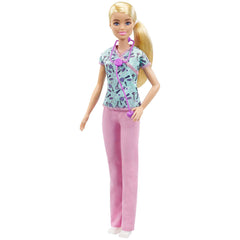 Barbie Nurse Blonde Doll in scrubs with a medical-tool print top for imaginative care play.