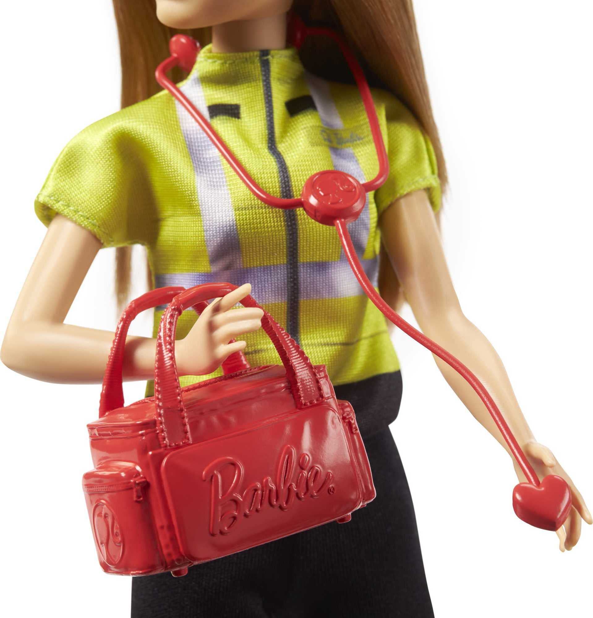 Barbie paramedic doll with medical bag enhances pretend patient care.
