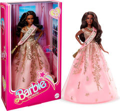 Barbie The Movie President Doll wearing shimmery pink gown and sash for display.