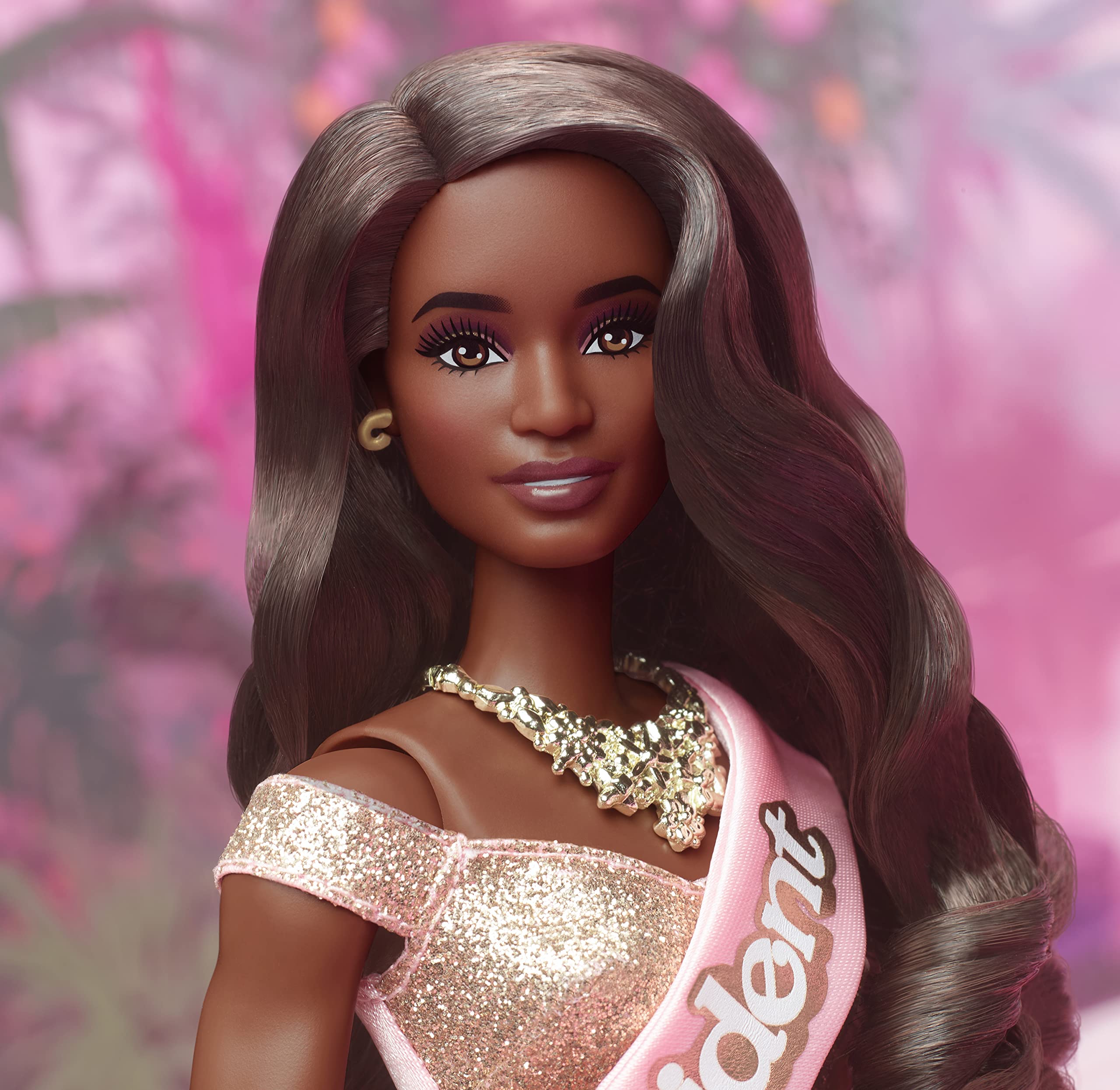 Barbie The Movie premium doll features bouncy curls and elaborate necklace.