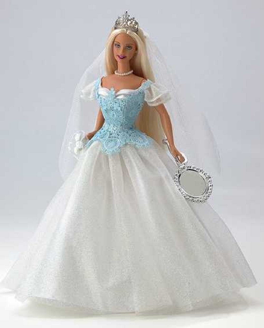 Barbie Princess Bride silver tiara and veil provide sparkly accessory details for storytelling.