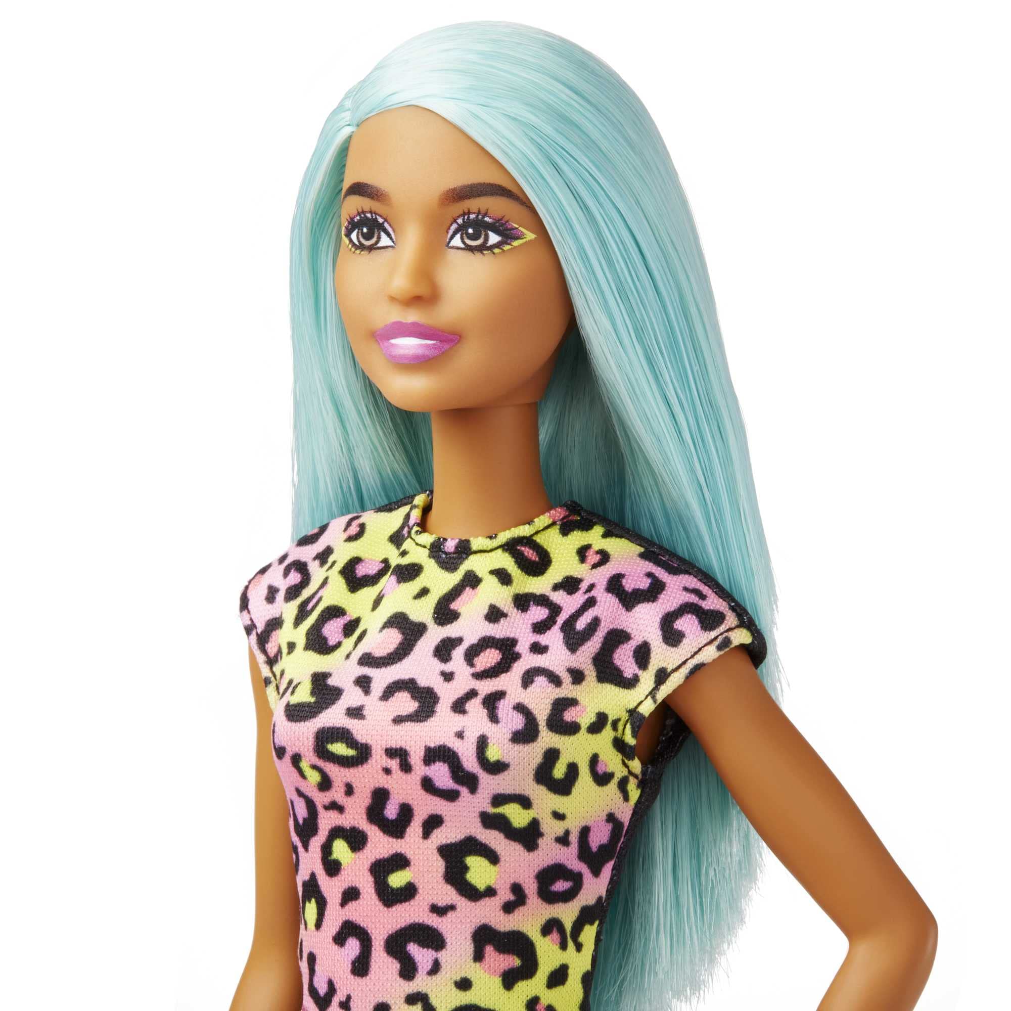Barbie doll wearing print-on apron for salon-themed storytelling.