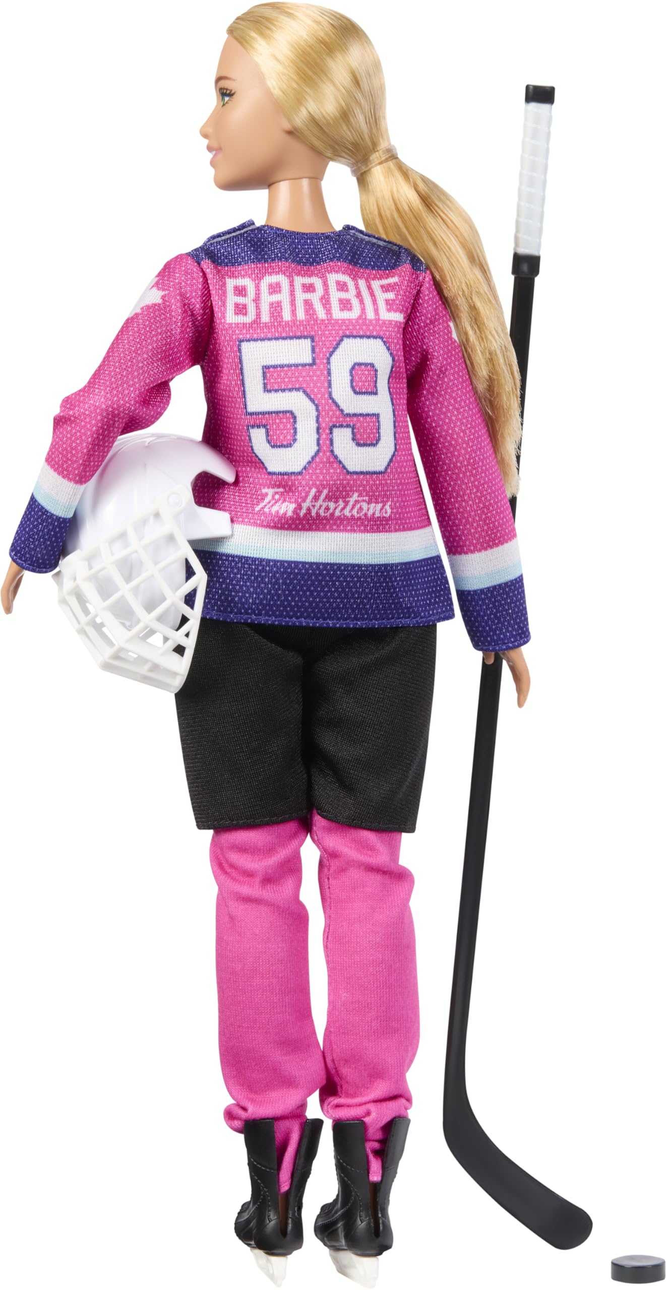 Barbie PWHL doll with puck, ready to pass and score during play.