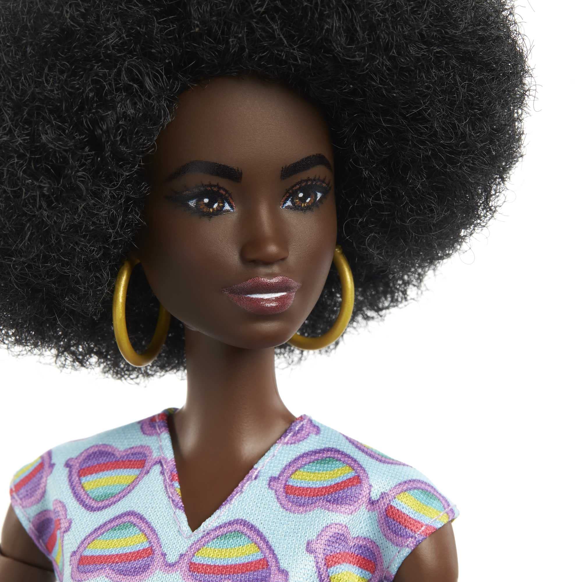 Barbie rainbow-heart-romper outfits create colorful fashion moments in play.
