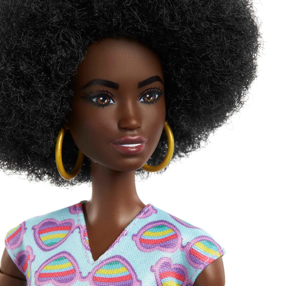 Barbie rainbow-heart-romper outfits create colorful fashion moments in play.