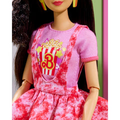 Barbie Rewind doll popcorn earrings add playful detail for display.