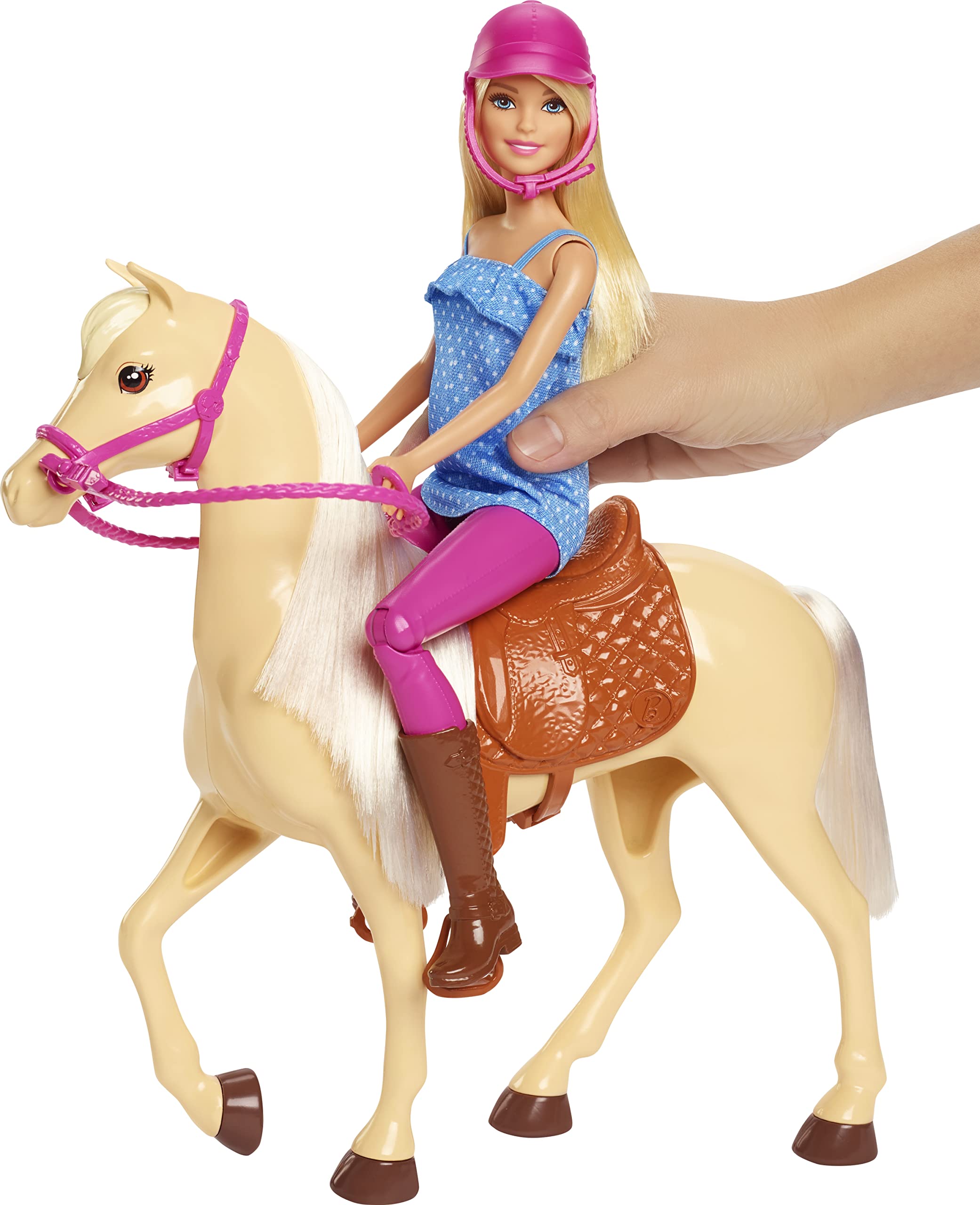Barbie wearing riding outfit with pink pants and denim top.