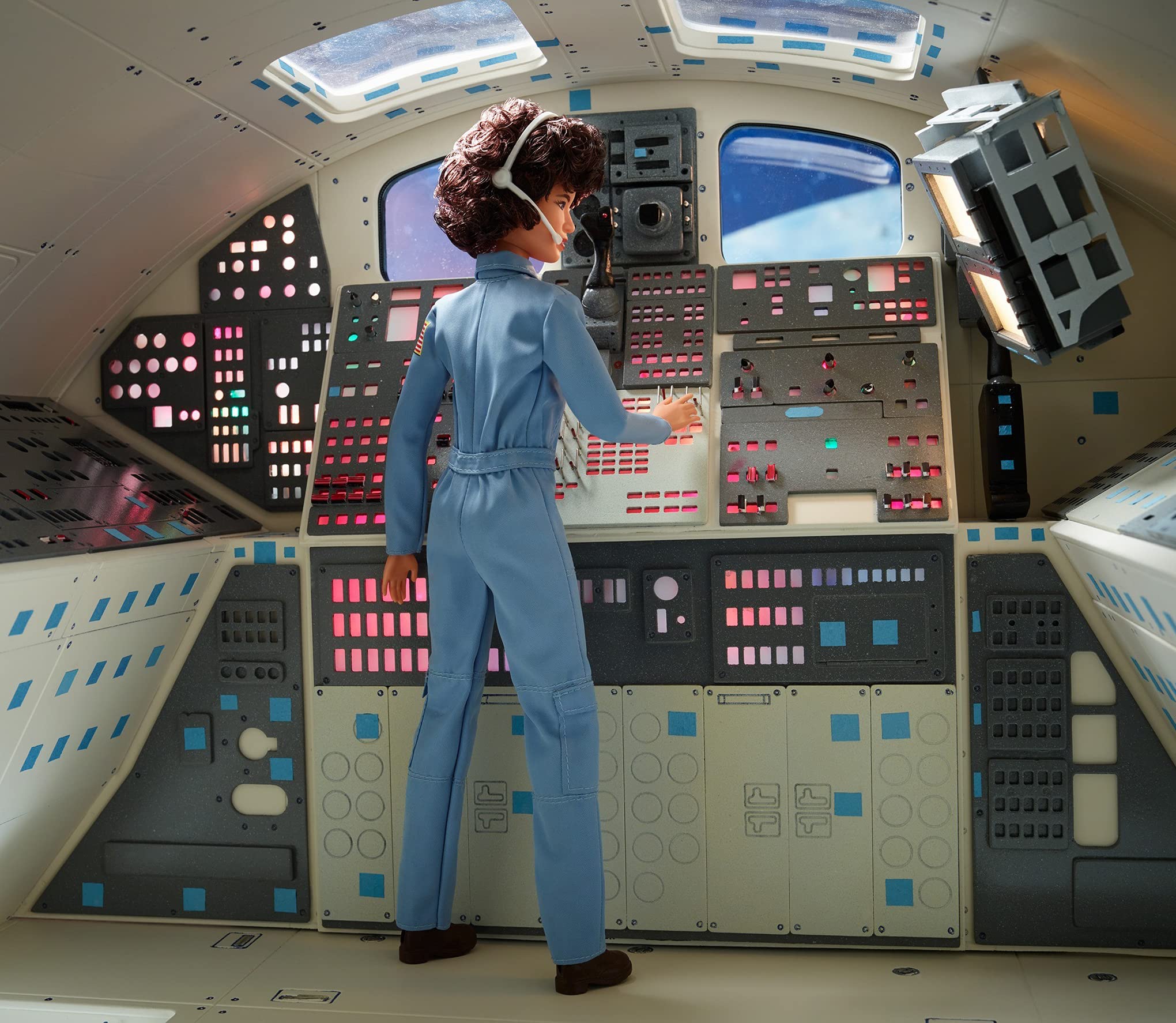 Barbie Sally Ride doll showcases curly brunette hair for lifelike posing and storytelling