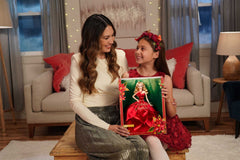 Barbie Signature 2022 Holiday Doll neckline poinsettia detail enhances festive display appeal