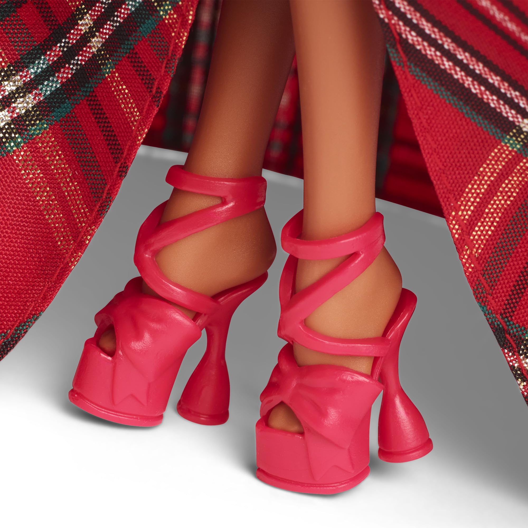Barbie Signature 2024 Holiday Doll with silver earrings adds holiday elegance
