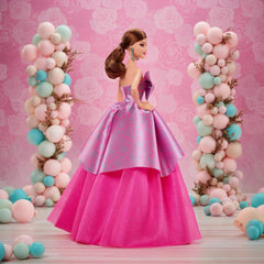 Barbie Signature Birthday Wishes dress detail highlights floral print and bow accents.