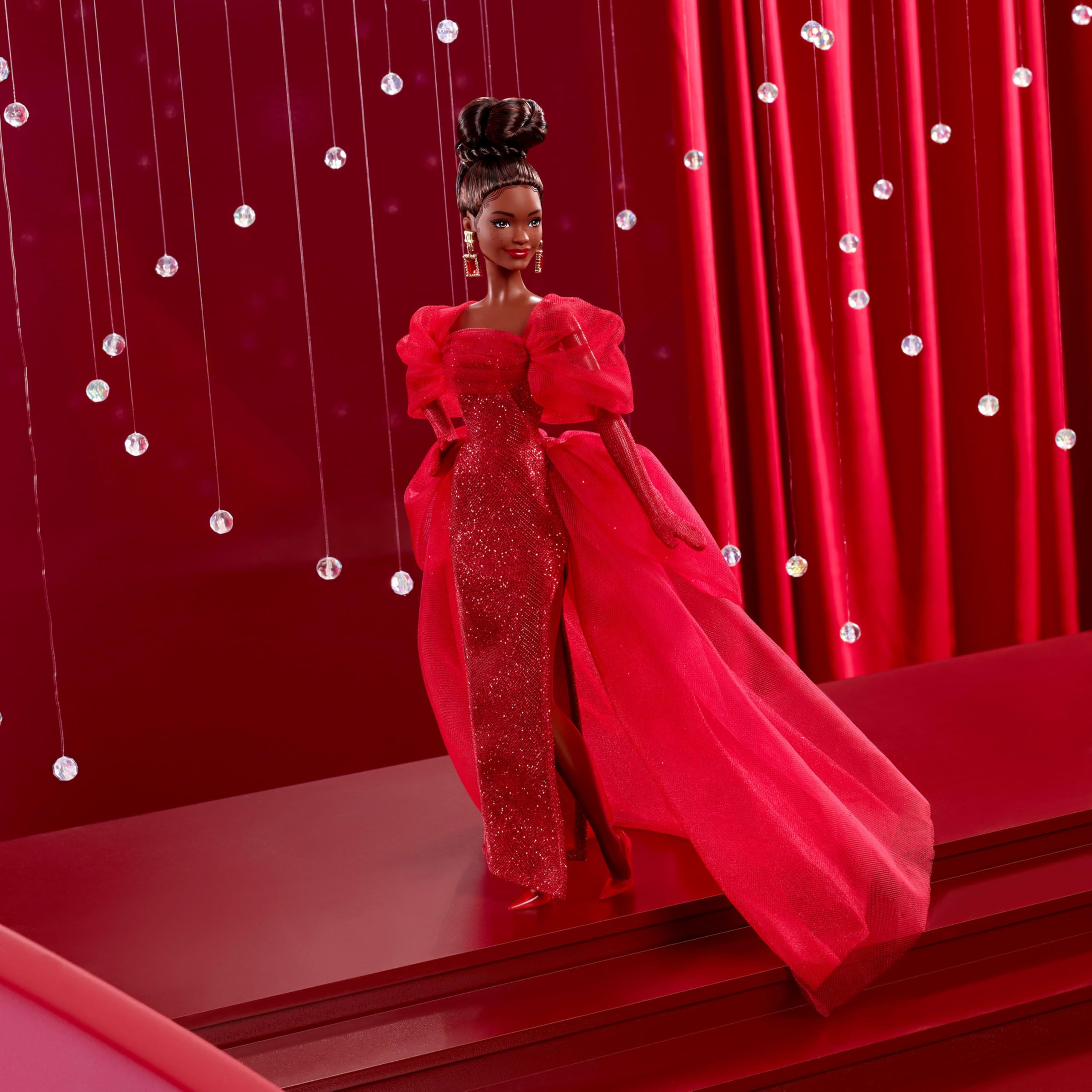 Barbie Signature Doll highlights tulle sleeves, bustle, and train for dramatic presentation.