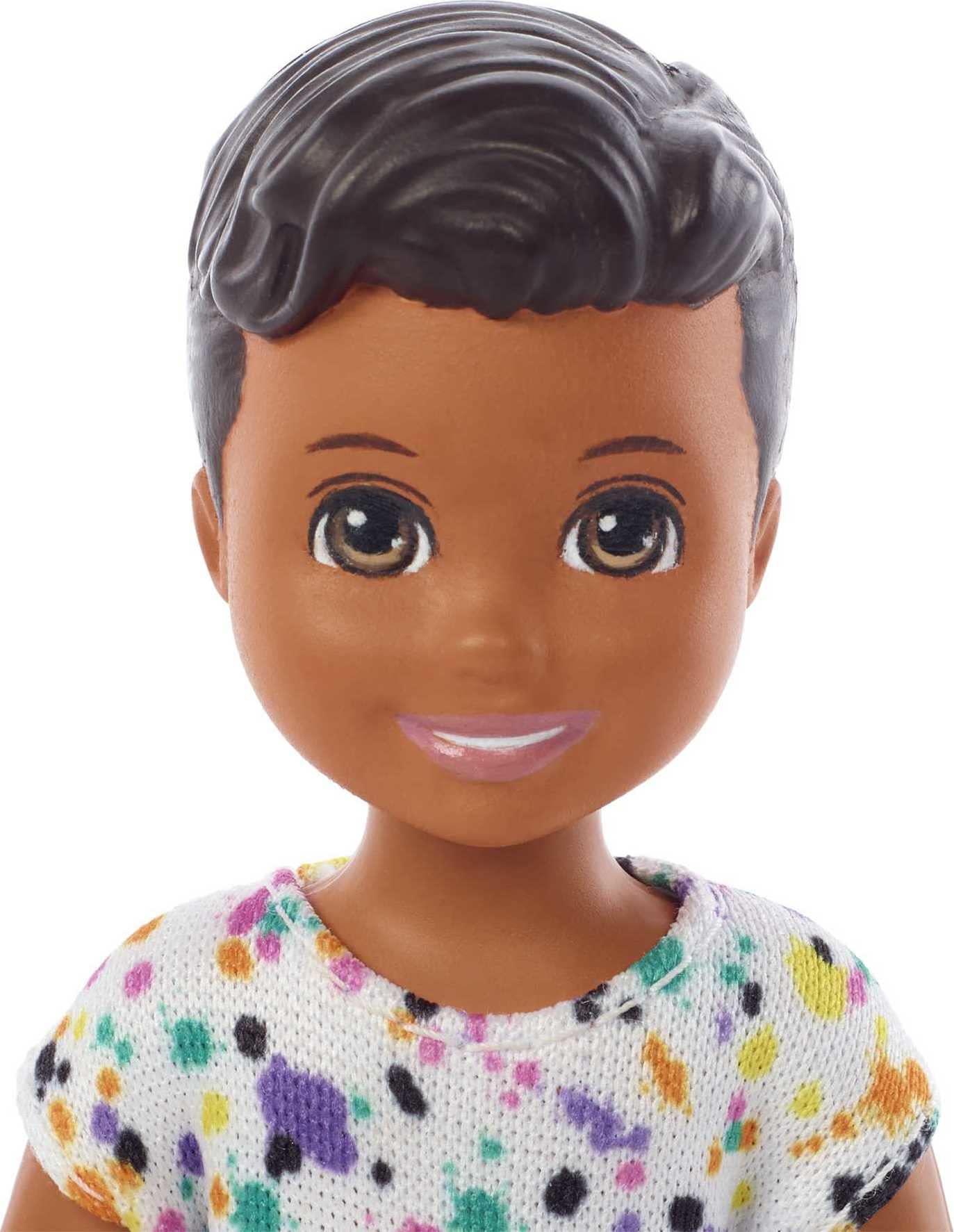Barbie Skipper Babysitters Inc doll holding handles enhances interactive feeding play.