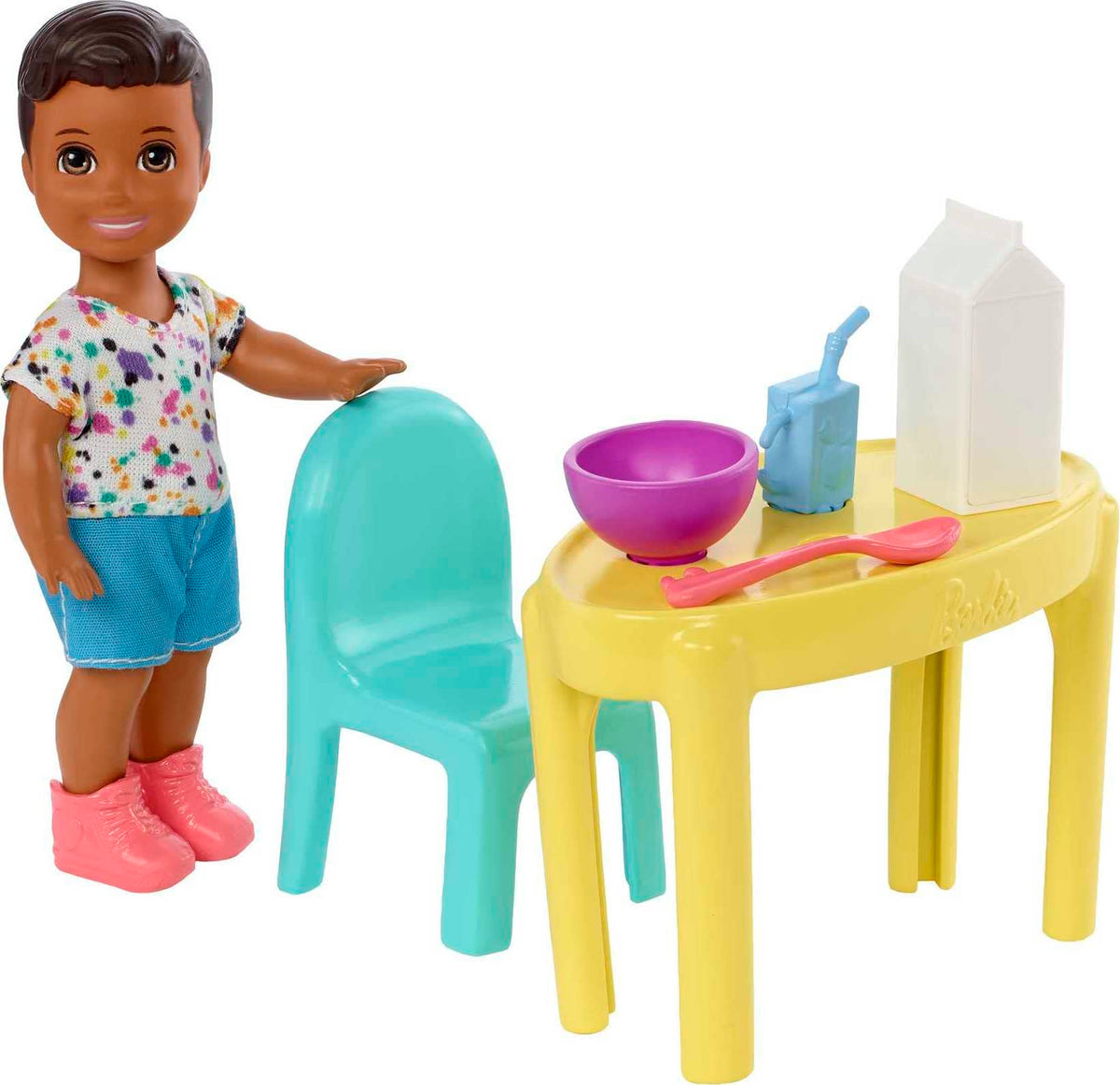 Barbie Skipper Babysitters Inc small doll beside table for mealtime storytelling.