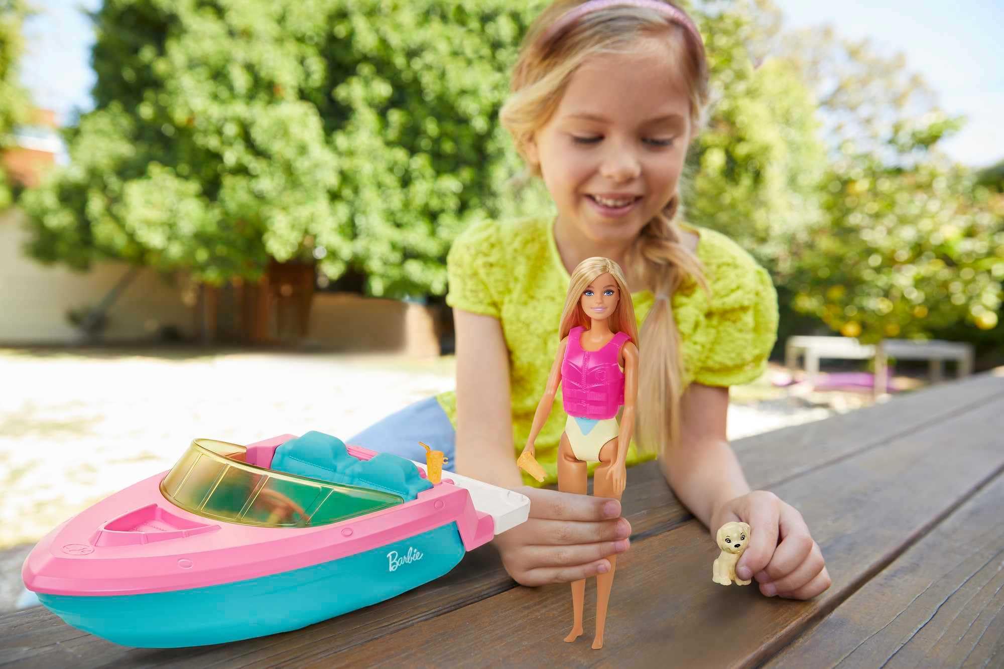 Barbie speedboat cockpit with life vest, ready for safe, stylish play.