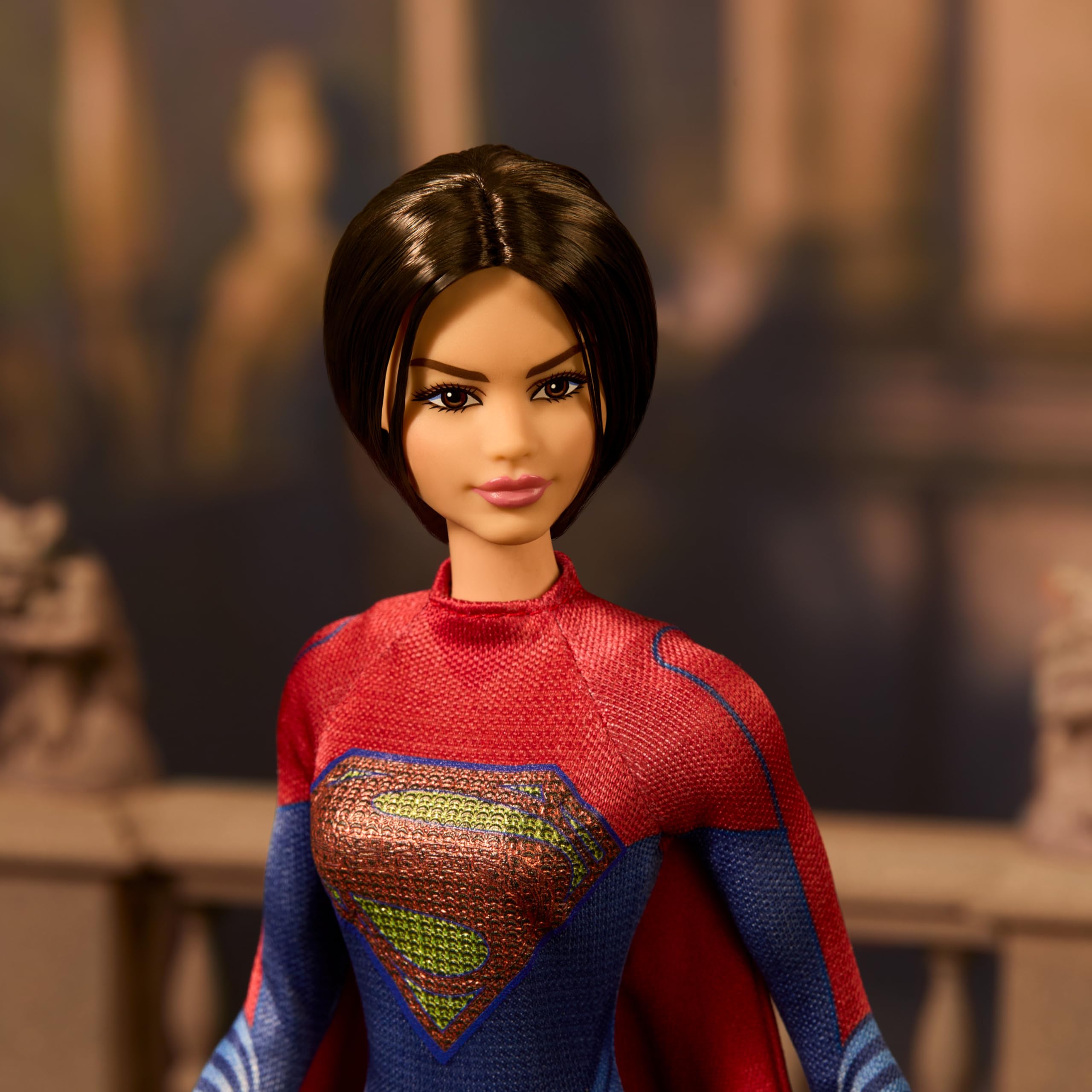 Barbie Supergirl cape flowing red adds cinematic flair for imaginative hero play.