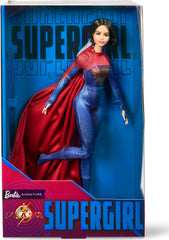 Barbie Supergirl doll in red and blue suit with S-shield for display and collection.