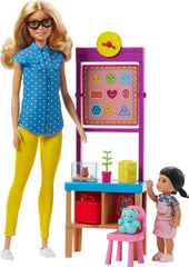 Barbie teacher doll beside classroom desk for organized play and role-play