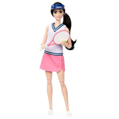 Barbie tennis racket and ball accessories for active play.
