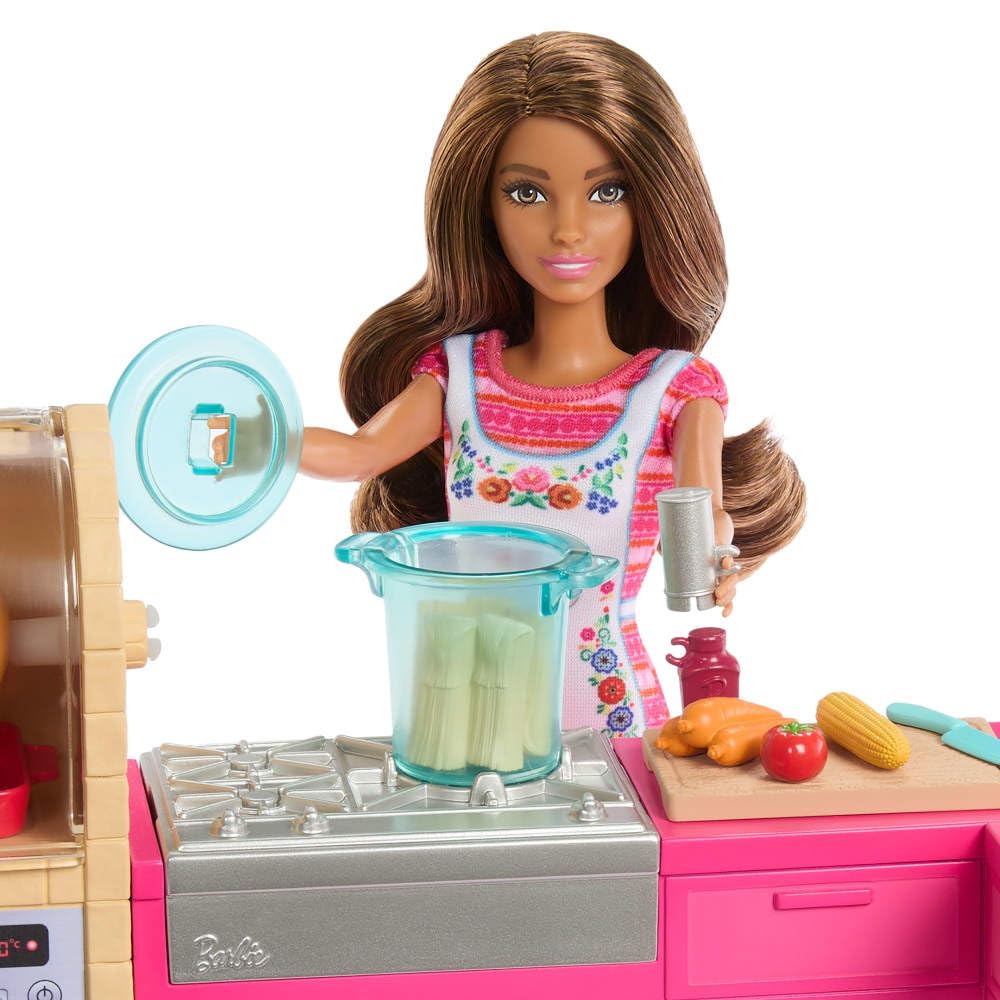Barbie Teresa's veggies and tamales add realistic cooking scenes to playset.