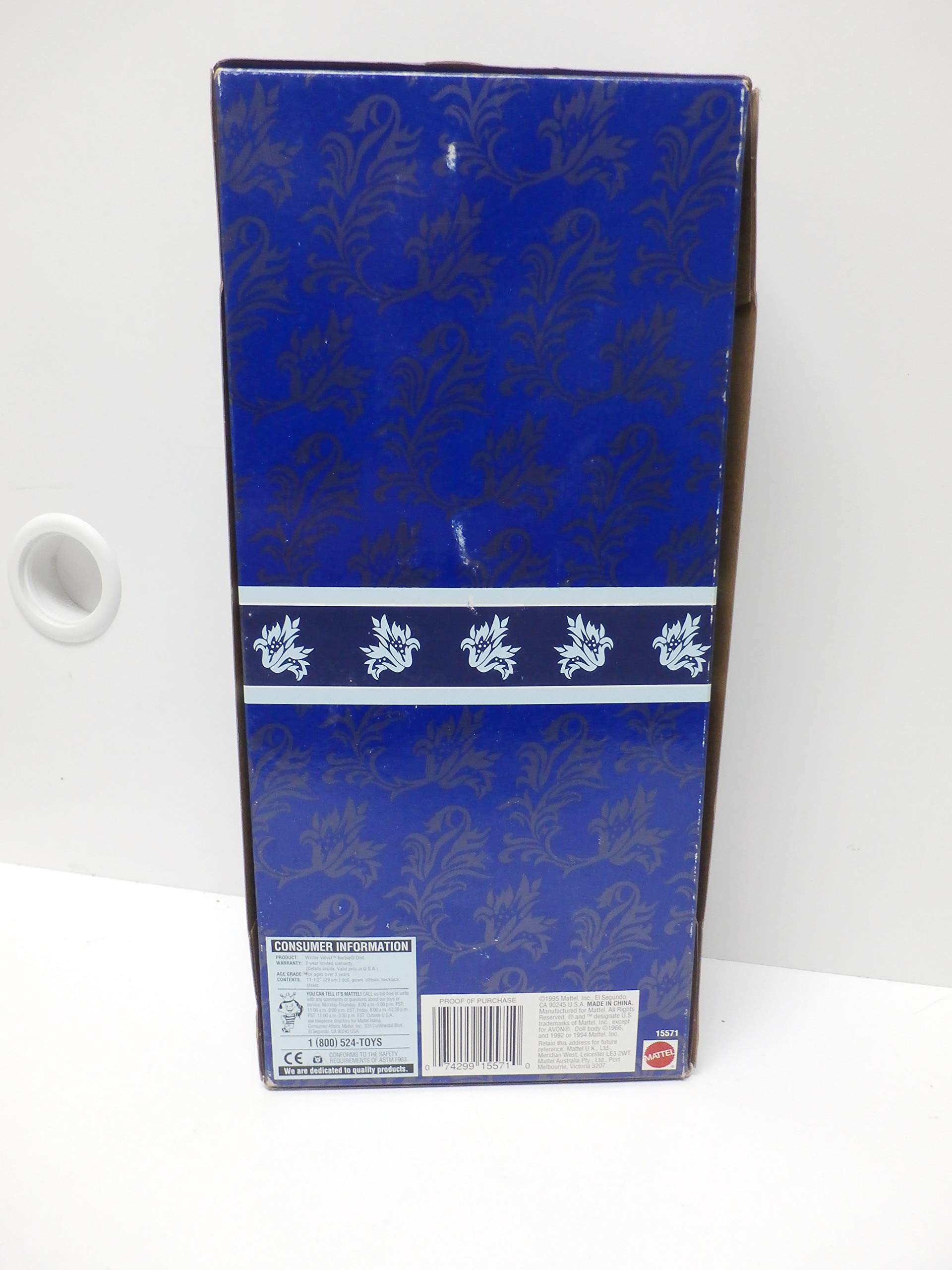 Barbie Winter Velvet doll with blue hair bow and stand, ready for elegant display.