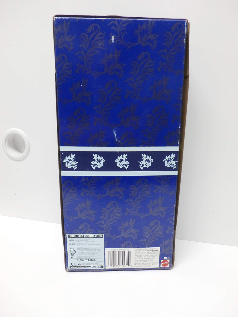 Barbie Winter Velvet doll with blue hair bow and stand, ready for elegant display.