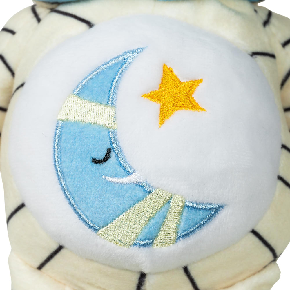 Unique belly badge with sleepy moon wrapped in bandages for a playful vibe.