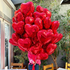 BBPOOL Valentines Day party setup with heart balloons and ribbons.