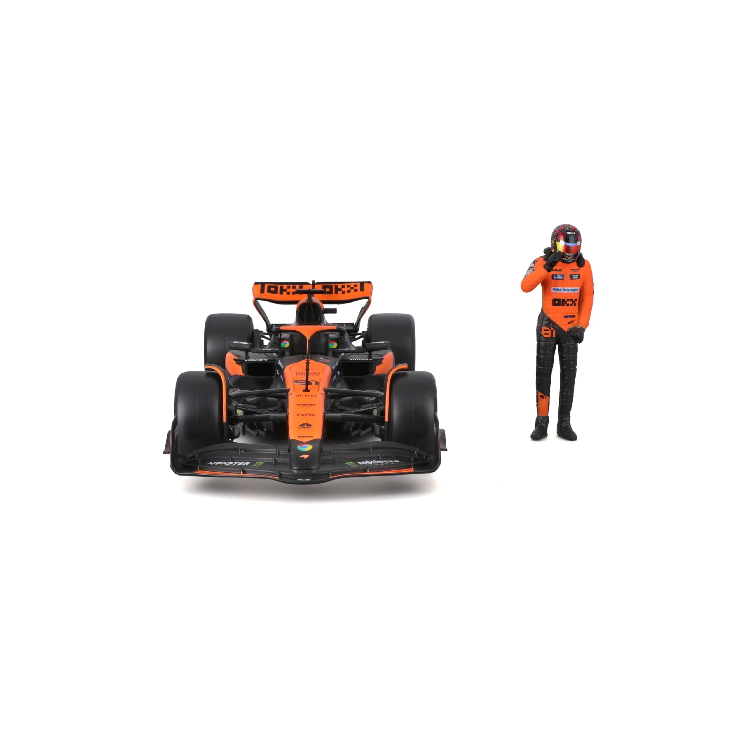Bburago McLaren MCL38 driver figure seated in champion pose for display.