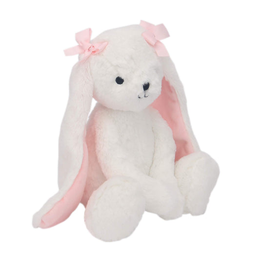 Snowflake bunny close-up shows pink bows and soft fur for tactile play.