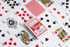 Bee playing cards in red and blue variants on a table