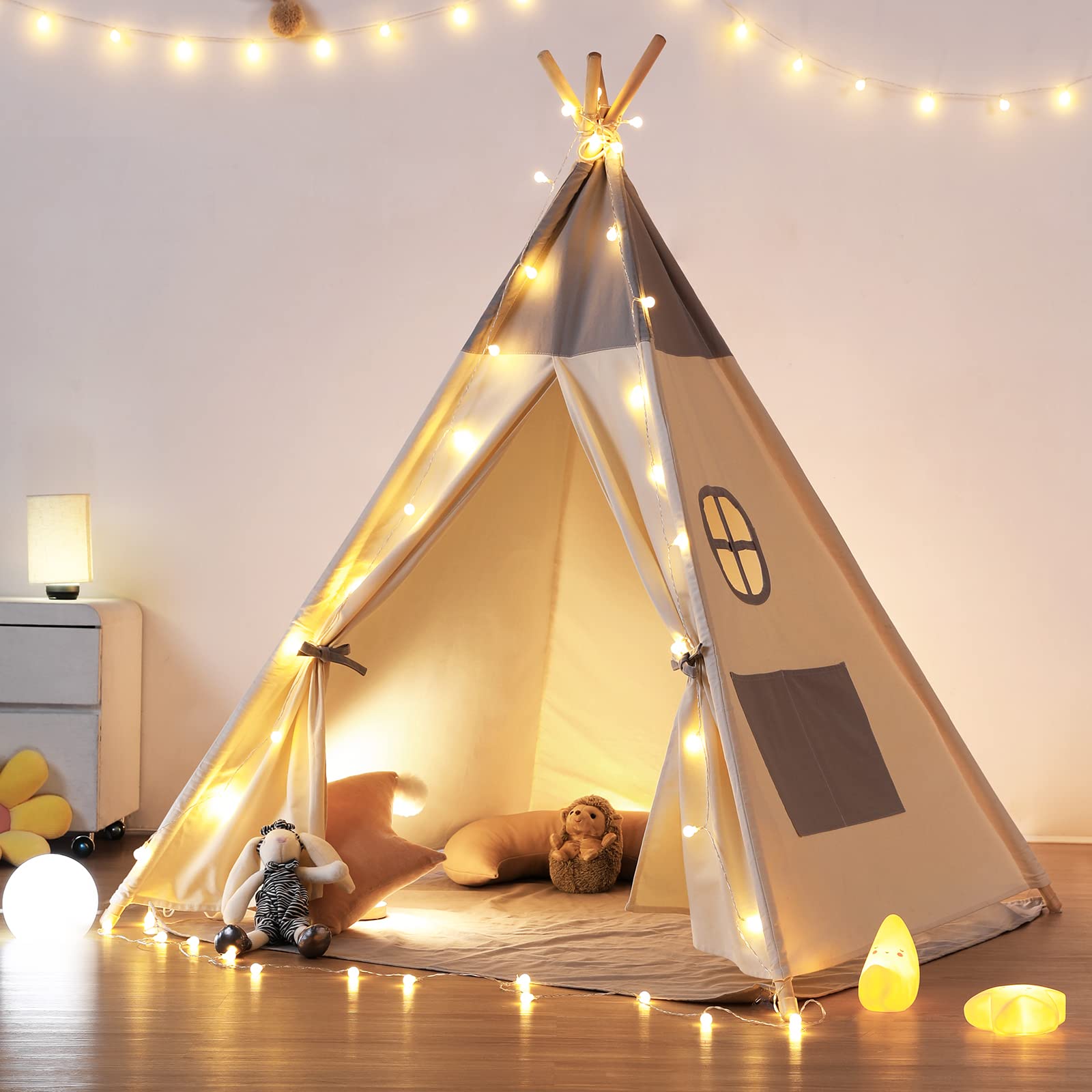 Besrey teepee tent for kids with lights creates a cozy indoor play space.